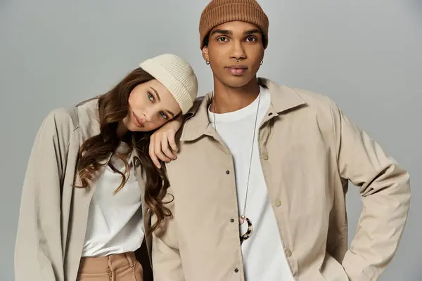 A fashionable couple poses in warm autumn attire, exuding style and comfort during fall. — Stock Photo