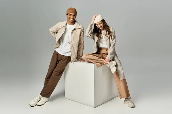 This fashionable duo enjoys their autumn outing, showcasing vibrant seasonal attire. — Stock Photo