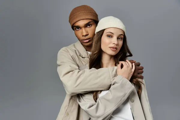 A young couple showcases their trendy autumn fashion while enjoying each others company. — Stock Photo