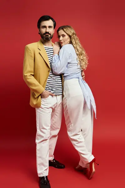 A middle aged couple displays trendy outfits, showcasing their style and confidence together. — Stock Photo