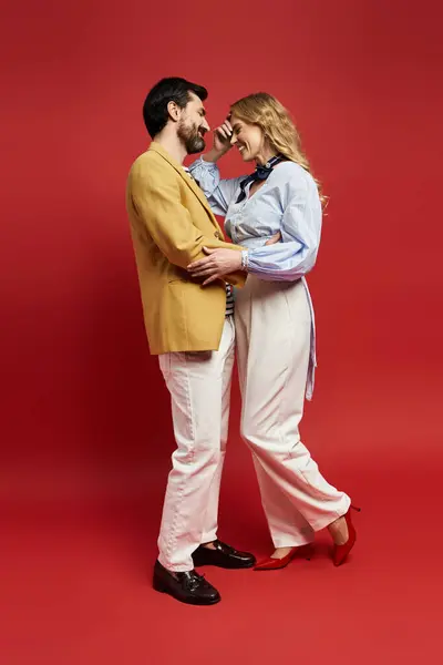 A middle aged couple embraces playfully, sharing a moment of laughter and connection together. — Stock Photo