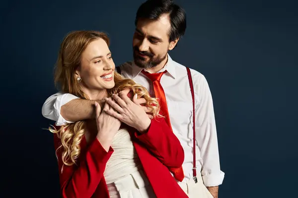 A middle aged couple shares a warm embrace, exuding happiness in their playful interaction. — Stock Photo