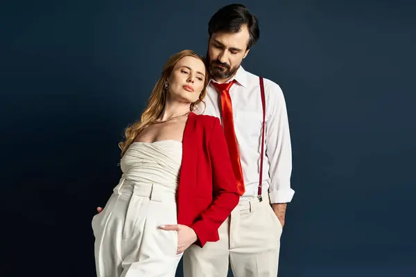 A middle aged couple expresses their unique styles with a vibrant outfit combination and poses. — Stock Photo