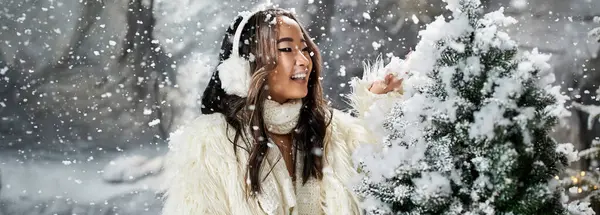 Delightful celebration of Christmas with snowflakes falling as a person enjoys the festive spirit — Stock Photo
