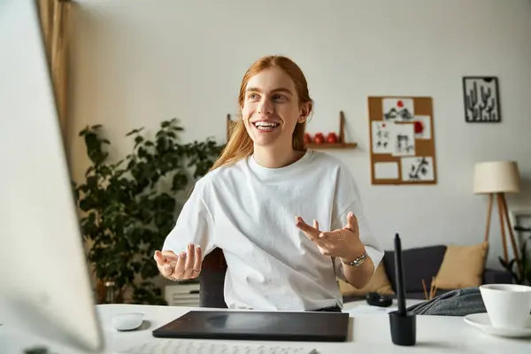 A young man joyfully discusses with enthusiasm in a contemporary, light filled office. — Stock Photo