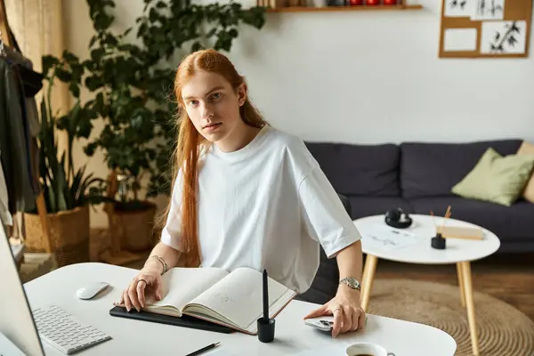 The young man is focused on his notebook, creating something unique in a serene environment. — Stock Photo