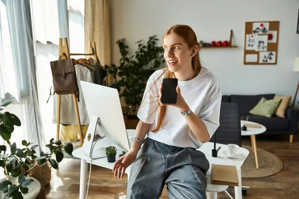 A young man engages in a lively chat while surrounded by comfortable furnishings and plants. — Stock Photo