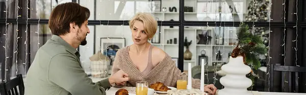 A couple enjoys a serene breakfast together at their home, filled with warmth and connection. — Stock Photo