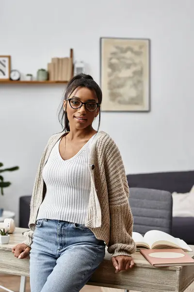 A young woman studies remotely from her home, exuding focus and comfort in her cozy space. — Stock Photo