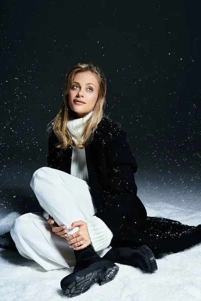 A lovely woman in winter clothing enjoys a tranquil moment amidst falling snowflakes — Stock Photo