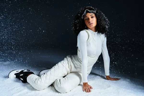 A stunning brunette African American woman showcases winter fashion, exuding elegance in a cozy studio atmosphere. — Stock Photo