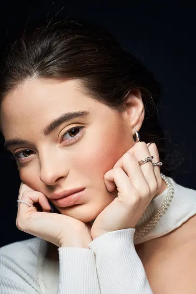 A stunning woman with an elegant pose showcases her beauty and style in a cozy environment. — Stock Photo