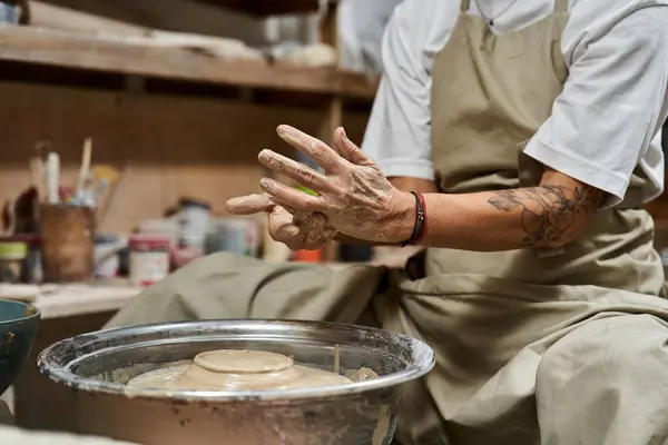 A passionate mature woman crafts a beautiful piece of pottery, showcasing her artistic talent. — Stock Photo