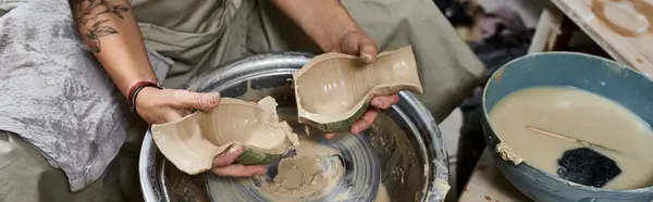 A mature woman passionately works with clay, crafting beautiful pieces in her serene studio. — Stock Photo
