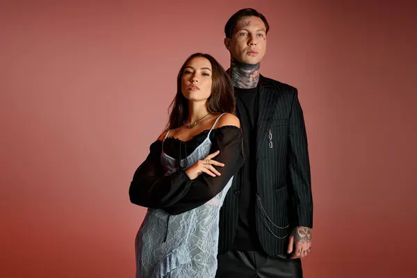 An attractive duo showcases modern fashion while striking a confident pose together. — Stock Photo