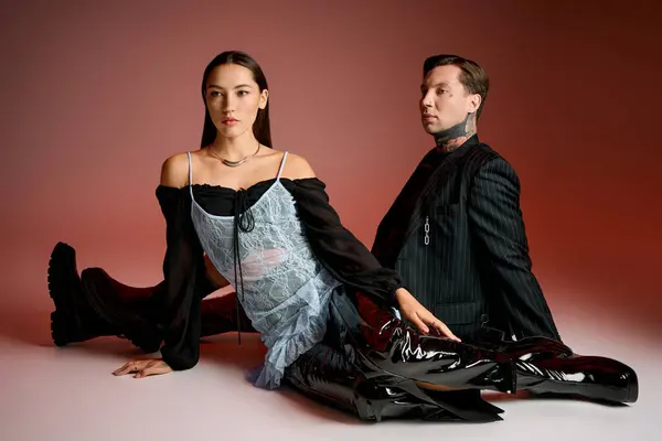 A young attractive pair showcases their unique fashion choices with confidence and flair. — Stock Photo