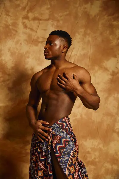 A young handsome African American man poses confidently with a captivating expression. — Stock Photo