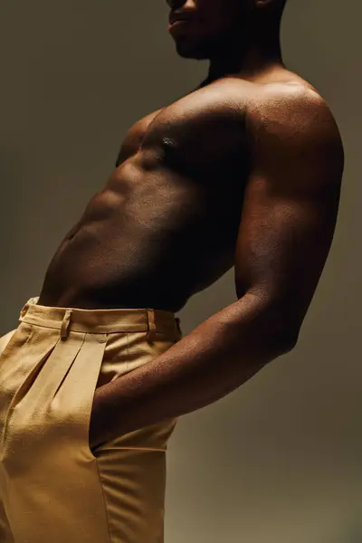 A young, handsome african american man poses topless, showcasing his toned physique with a confident expression. — Stock Photo