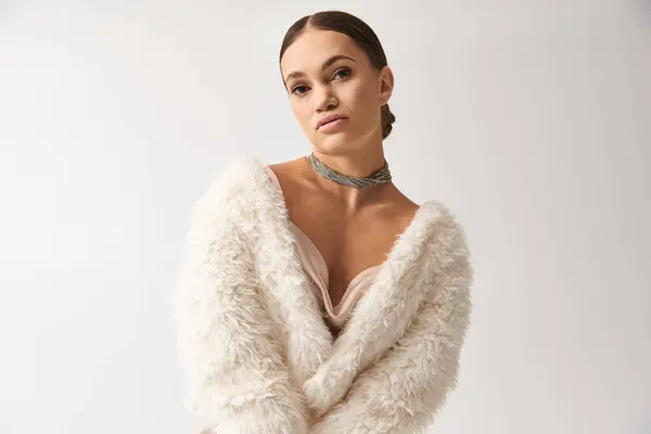 Elegant young woman with achondroplasia models fashionable attire with style and grace in a vibrant studio. — Stock Photo
