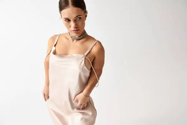 Young woman with short stature poses gracefully in a stunning dress, celebrating diversity. — Stock Photo