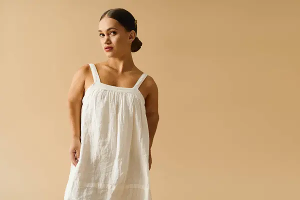 A young woman with short stature poses gracefully in an elegant dress, embodying diversity. — Stock Photo