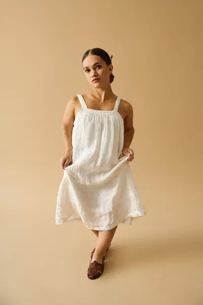 Young woman with short stature poses gracefully in a pretty dress, showcasing diversity. — Stock Photo