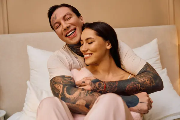 A man and woman embrace happily, radiating warmth and affection for each other in their space. — Stock Photo