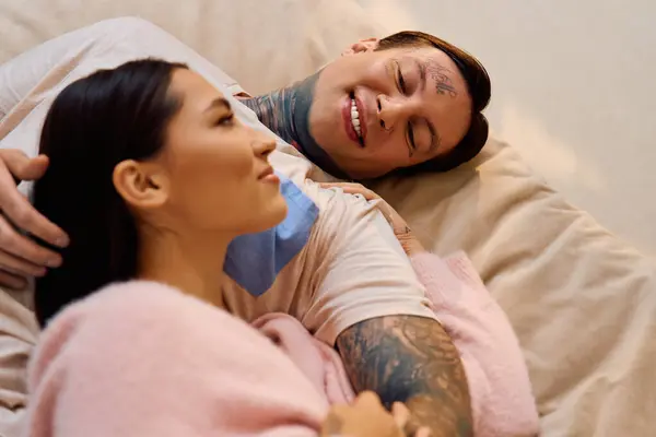 Young couple enjoys intimate moments wrapped in warmth and affection on a comfortable couch. — Stock Photo