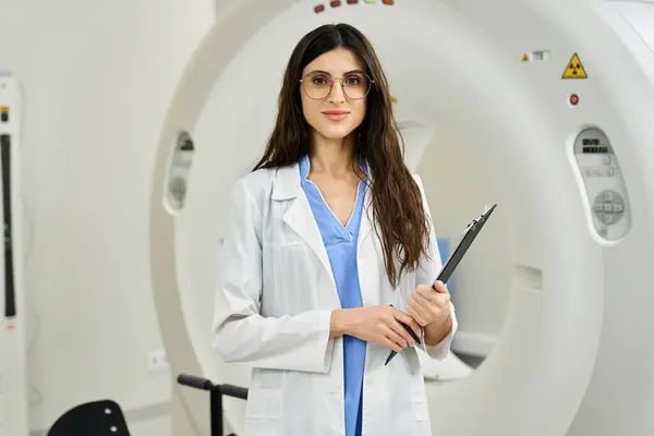 Skilled doctor in a lab coat prepares for patient diagnostics in a modern hospital setting. — Stock Photo