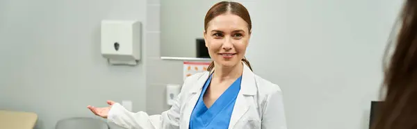 A professional gynecologist engages with a patient, ensuring female health care needs are met. — Stock Photo