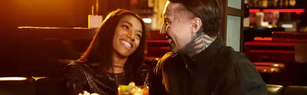 Beautiful couple shares a joyful moment on their date, surrounded by vibrant nightlife. — Stock Photo