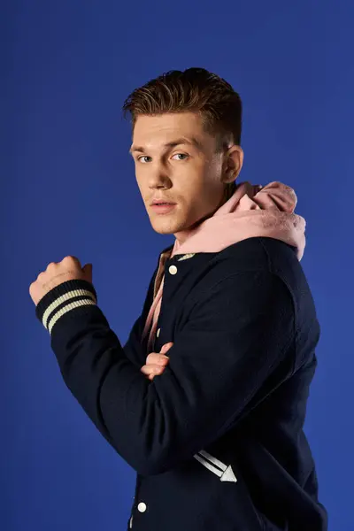 Young man wearing a stylish outfit and posing confidently. — Stock Photo