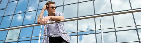 Stylish young man enjoys a confident day outdoors. — Stock Photo