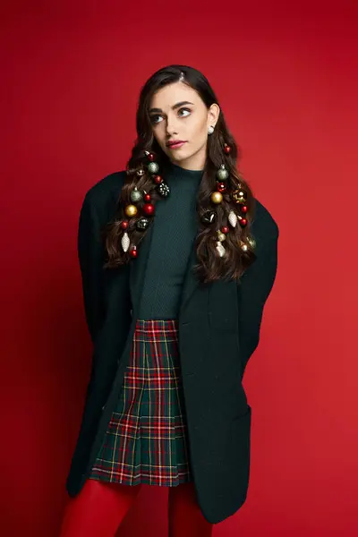 The young woman celebrates the season with colorful hair ornaments and festive attire. — Stock Photo