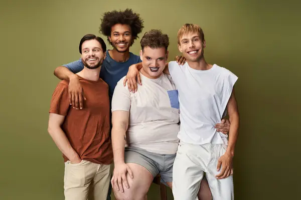Four diverse individuals joyfully pose together, showcasing pride and strong friendship. — Stock Photo