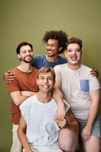 Four friends celebrate their unique identities with vibrant smiles and unity. — Stock Photo