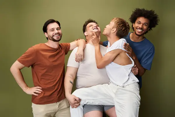 Four friends share a joyful moment, expressing love and support in a vibrant environment. — Stock Photo
