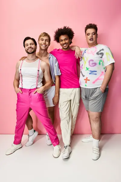 Four friends pose joyfully in bright, bold outfits, showcasing their pride and unity together. — Stock Photo