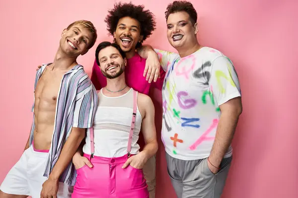 Four friends showcase their colorful outfits and joyful smiles at a pride celebration. — Stock Photo