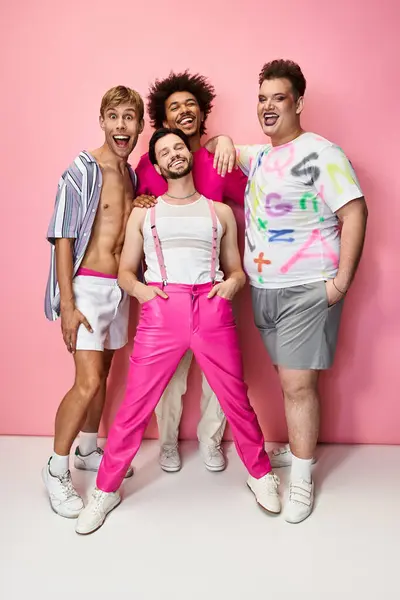 Friends pose playfully together, showcasing their vibrant outfits and expressing joy and pride. — Stock Photo