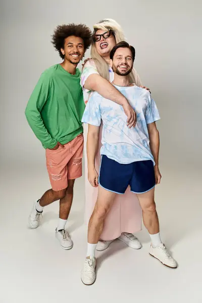 Three friends share laughter and joy, showcasing their vibrant personalities and pride spirit. — Stock Photo