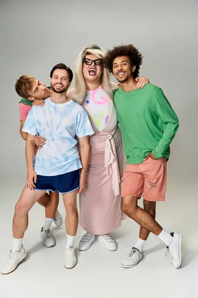 Four individuals express their pride and vibrancy through colorful outfits. — Stock Photo