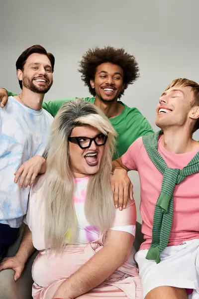 Group of friends exuding joy and pride with vibrant outfits during a cheerful gathering. — Stock Photo