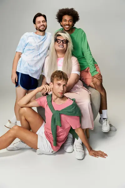 Four individuals express joy and confidence in a cheerful and vibrant indoor atmosphere. — Stock Photo