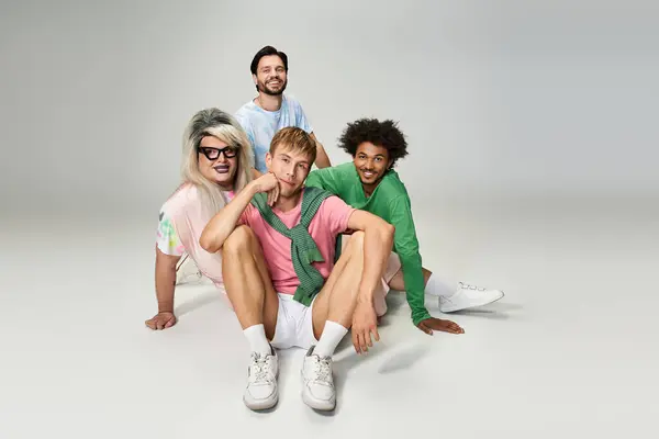 A diverse group of friends showcases vibrant outfits, embodying joy and inclusivity together. — Stock Photo