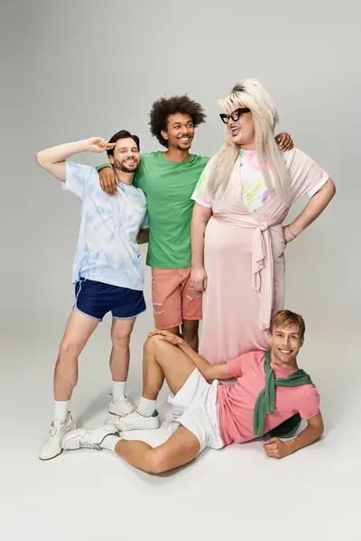 Group of friends expressing pride and joy through vibrant outfits and lively poses together — Stock Photo