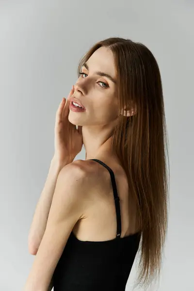 A young woman with long hair shows her beauty and vulnerability in her fight against anorexia. — Stock Photo