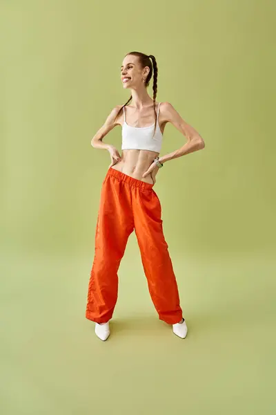 Young woman with a strong presence showcases fashion while embodying a personal struggle. — Stock Photo