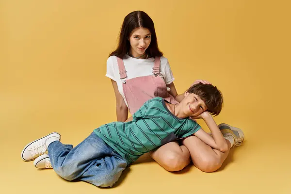 A young mother sits with her son, sharing laughter and warmth in a lively studio setting. — Stock Photo