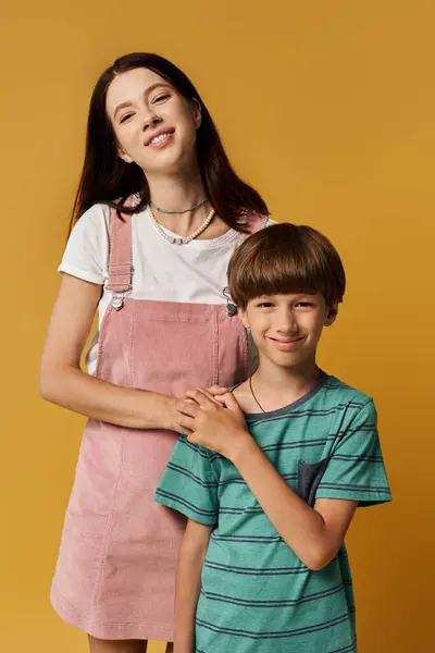 Young mother and her son share a warm moment in a vibrant studio, radiating happiness and love. — Stock Photo